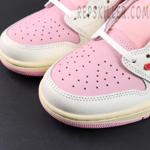 Travis Scott x Jordan 1 Low OG “Tropical Pink” sneakers, toe box close-up showing perforated leather and pink upper detail