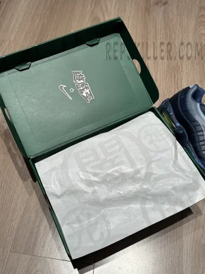 Inside view of the Yu-Gi-Oh! x Air Max Muscle 95 QS box showing custom tissue paper with Duel icons.
