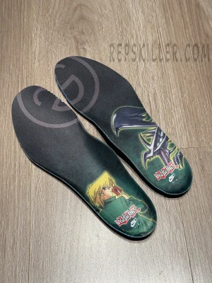 Custom insoles of the Yu-Gi-Oh! x Air Max Muscle 95 QS featuring Joey and Red-Eyes Black Dragon artwork.