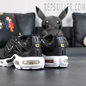 Rear angled view of Nike Air Max Plus Black White featuring TN Air heel branding