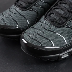 Toe box close-up of Nike Air Max Plus Multi Swoosh Black Bright Crimson with black mesh and TPU overlays