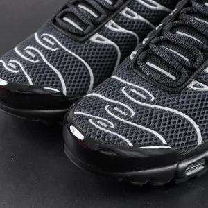 Nike Air Max Plus Premium toe box close-up with breathable black mesh and metallic silver lines