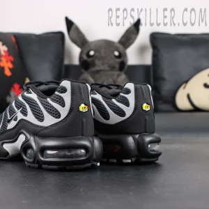 Nike Air Max Plus Premium rear angled view showing black midsole and visible Air unit