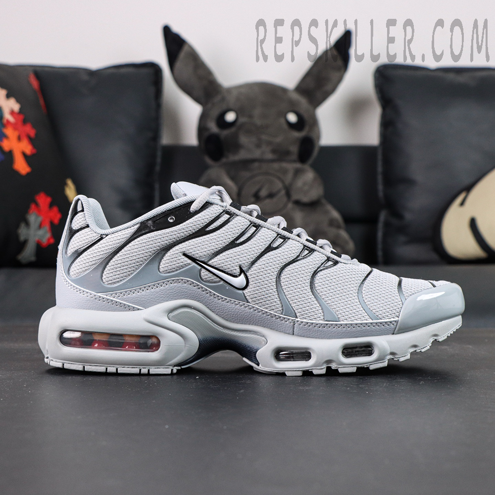 Side view of Nike Air Max Plus TN Wolf Grey featuring signature TPU overlays and iconic Nike Swoosh