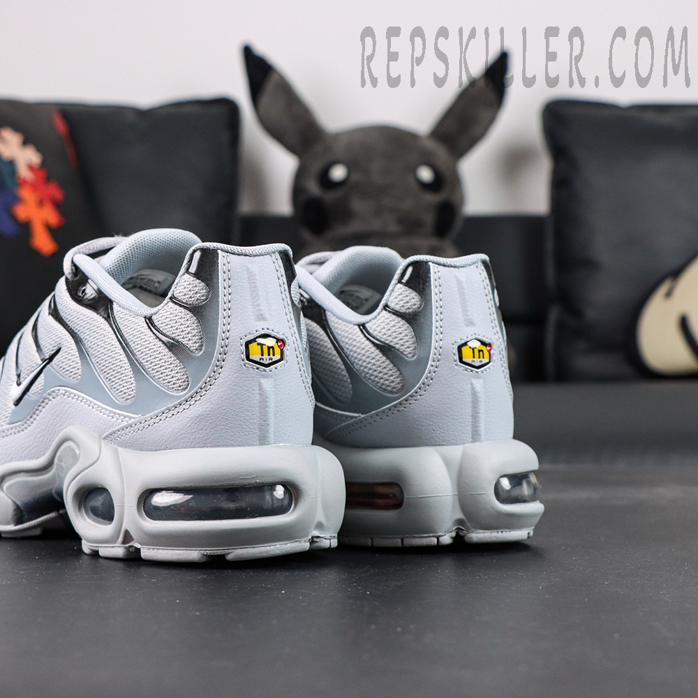 Rear view of Nike Air Max Plus TN Wolf Grey highlighting TN Air badge and visible heel Air unit