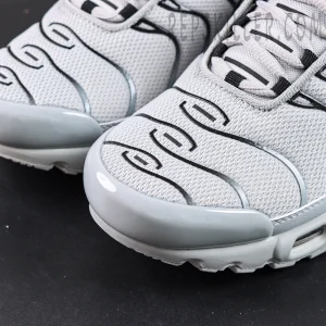 Close-up of the toe box on Nike Air Max Plus TN Wolf Grey featuring mesh material and wave-shaped TPU lines