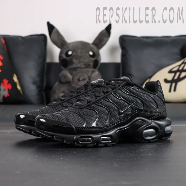 Nike Air Max Plus Triple Black sneakers front angled view