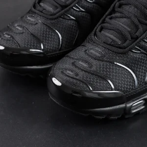 Nike Air Max Plus Triple Black sneakers close-up of mesh upper and toe box