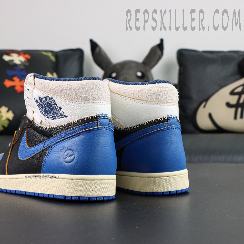 Fragment Design x Union LA x Air Jordan 1 “Sport Royal” collaboration sneakers, rear view showing blue heel panels and Fragment lightning logo