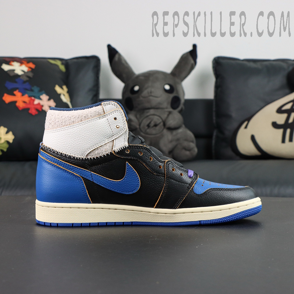 Fragment Design x Union LA x Air Jordan 1 “Sport Royal” collaboration sneakers, lateral side view with royal blue Swoosh and exposed stitching