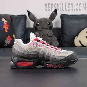 Side profile of Nike Air Max 95 Big Bubble Solar Red showing layered suede and red Air unit