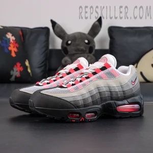 Angled front view of Nike Air Max 95 Big Bubble Solar Red sneakers on display