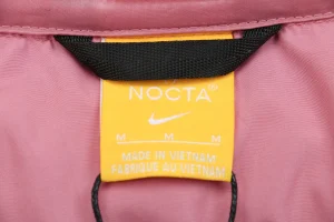 Nike x Drake NOCTA Stand Collar Down Jacket Pink Brand label