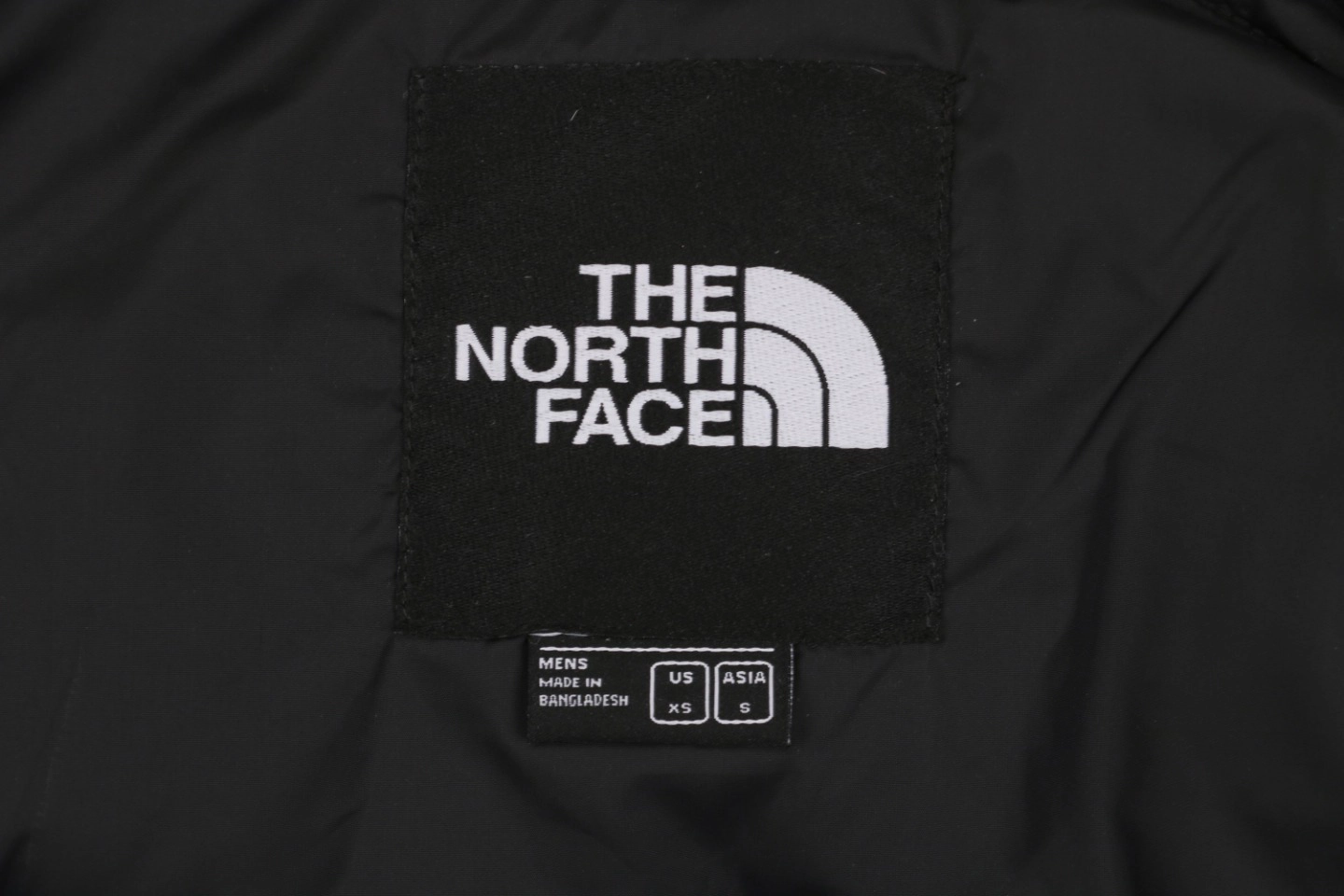 The North Face 1996 Retro Nuptse Down Jacket Brand label