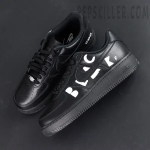 BLACK Comme des Garçons x Nike Air Force 1 Low black collaboration sneakers, top-down view showing silhouette and lace layout