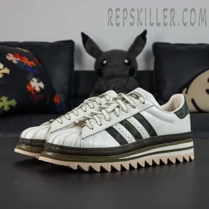 CLOT x BAPE x adidas Superstar “Off White Olive Cargo” sneakers, front side angle highlighting triple collaboration details and layered upper