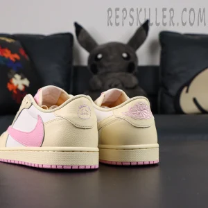 Travis Scott x Air Jordan 1 Low Muslin Pink sneakers, rear angle showing Wings embroidery and reverse Swoosh