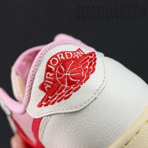 Travis Scott x Jordan 1 Low OG “Tropical Pink”, medial heel close-up with embroidered Air Jordan Wings logo