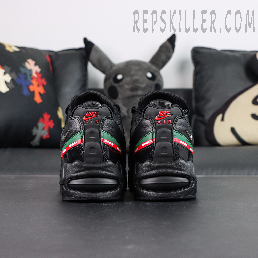 Undefeated x Nike Air Max 95 Black sneakers, rear view with red and green stripe and Nike Air branding