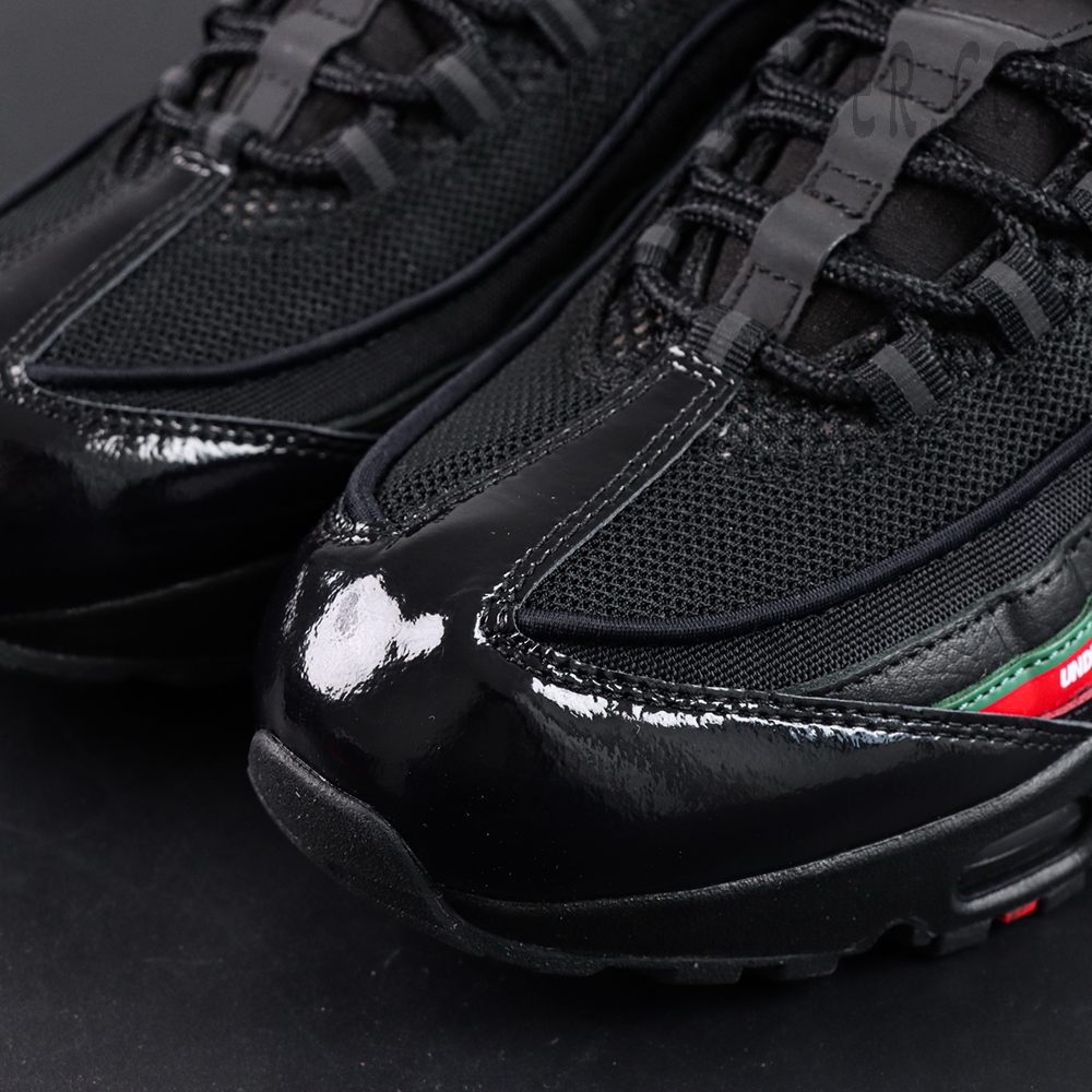 Undefeated x Nike Air Max 95 Black sneakers, toe box detail with patent leather and mesh panels