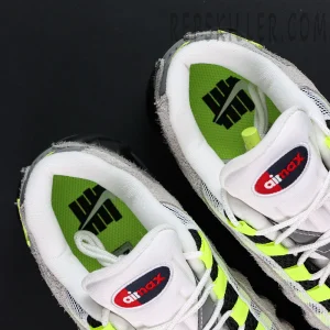 Undefeated x Nike Air Max 95 “NYC Neon” sneakers, top-down view showing tongue and neon green inner lining