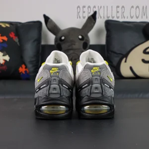 Undefeated x Nike Air Max 95 “Yellow” sneakers, straight rear view with Nike Air branding and visible Air units