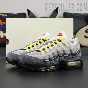 Undefeated x Nike Air Max 95 “Yellow” sneakers displayed with original shoebox, side profile view