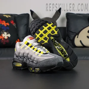Undefeated x Nike Air Max 95 “Yellow” sneakers, outsole-up view with black and yellow traction and UNDEFEATED branding
