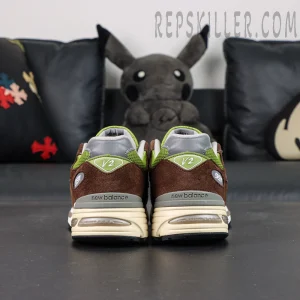 Daniëlle Cathari x Kith x New Balance 991v2 “Reverse” sneakers, rear view showing V2 branding and midsole structure