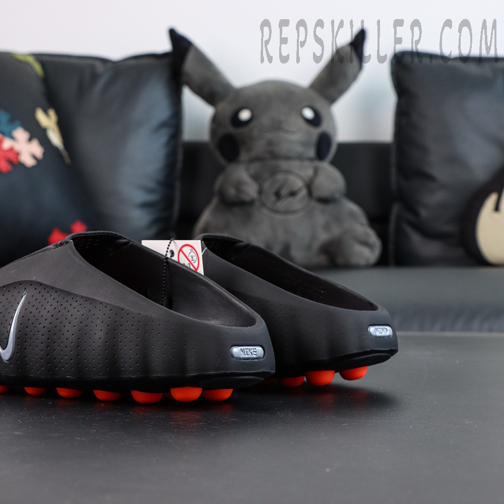 Nike Mind 001 “Black” clogs rear-side angle highlighting black upper and orange outsole contrast