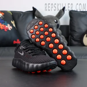 Nike Mind 002 “Black Hyper Crimson” outsole view highlighting vibrant orange cushioning pods