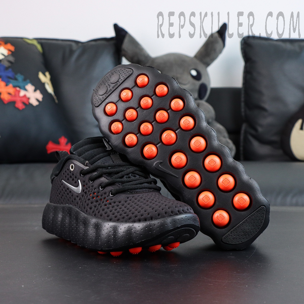 Nike Mind 002 “Black Hyper Crimson” outsole view highlighting vibrant orange cushioning pods