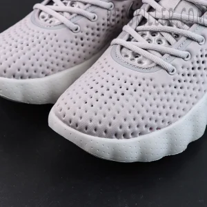 Nike Mind 002 “Light Smoke Grey” toe detail with dense perforations and soft material