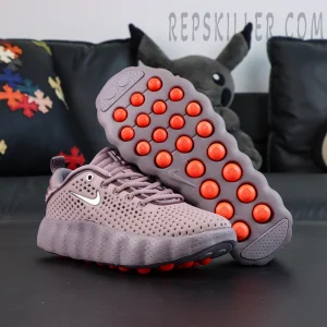 Nike Mind 002 “Light Violet Ore” outsole view highlighting orange cushioning pods