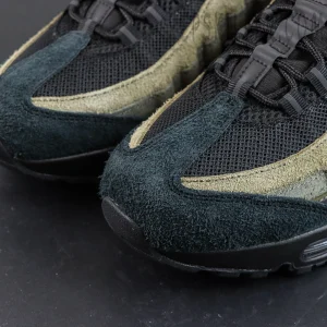 Undefeated x Nike Air Max 95 “Medium Olive” sneakers, toe box close-up with dark suede overlays and layered lines