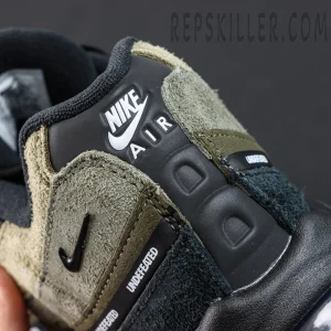 Undefeated x Nike Air Max 95 “Medium Olive” sneakers, heel close-up featuring Nike Air branding and textured panel