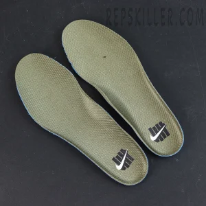 Undefeated x Nike Air Max 95 “Medium Olive” sneakers, insoles displayed with olive base and Undefeated logo