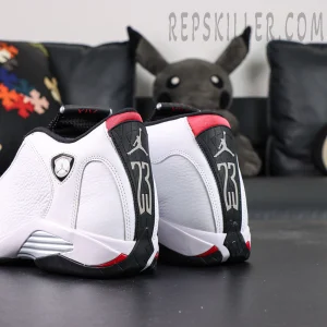 Air Jordan 14 heel close-up with shield logo and red accents