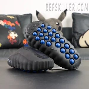 Nike Mind 001 Black outsole detail with blue traction pods for enhanced grip