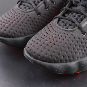 Nike Mind 002 toe box detail with dense perforation for breathability