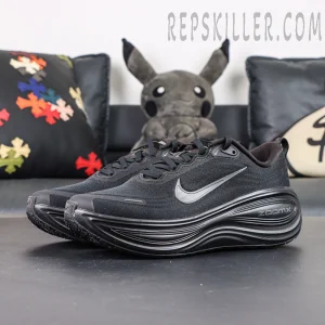 Nike Vomero Plus front angle with all-black upper and metallic grey Swoosh