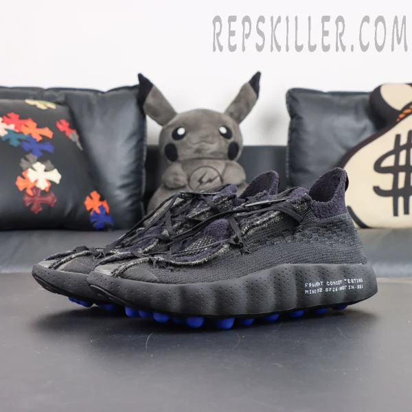 Fragment Design x Nike Mind 002 Flyknit “Black” angled front view with Flyknit woven upper and blue cushioned outsole