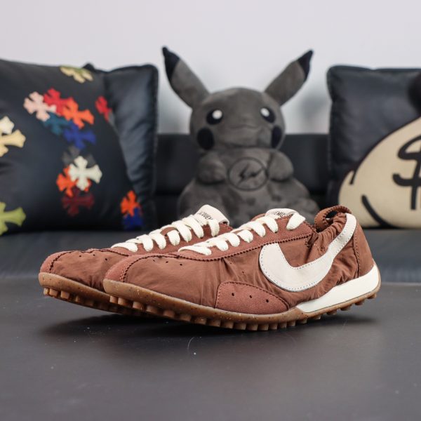 Jacquemus x Nike Moon Shoe SP “Fauna Brown” pair display featuring a sleek low-top profile and lightweight retro runner aesthetics