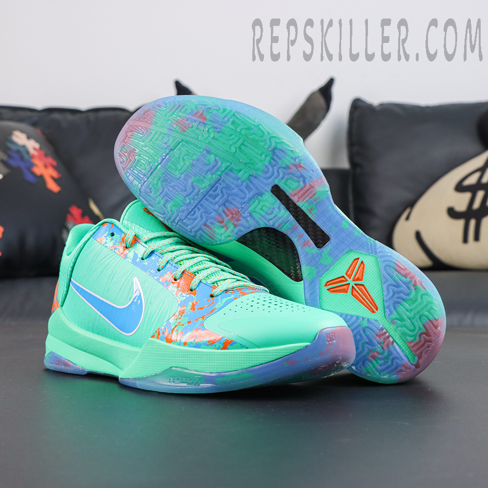 Jalen Brunson x Nike Zoom Kobe 5 Protro NY vs. NY pair display featuring mint green upper, orange blue splatter graphics and translucent outsole