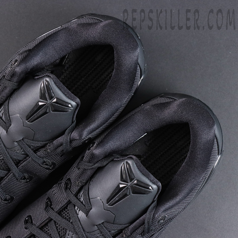 Kobe 9 Elite Low EM TB P Black tongue detail featuring Kobe branding with an all-black basketball shoe design
