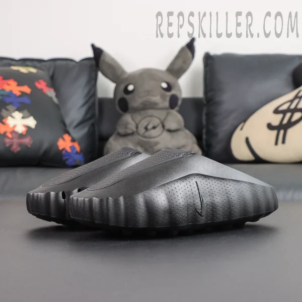 Nike Mind 001 ‘Triple Black’ front view featuring an all-black slip-on silhouette with streamlined minimalist design