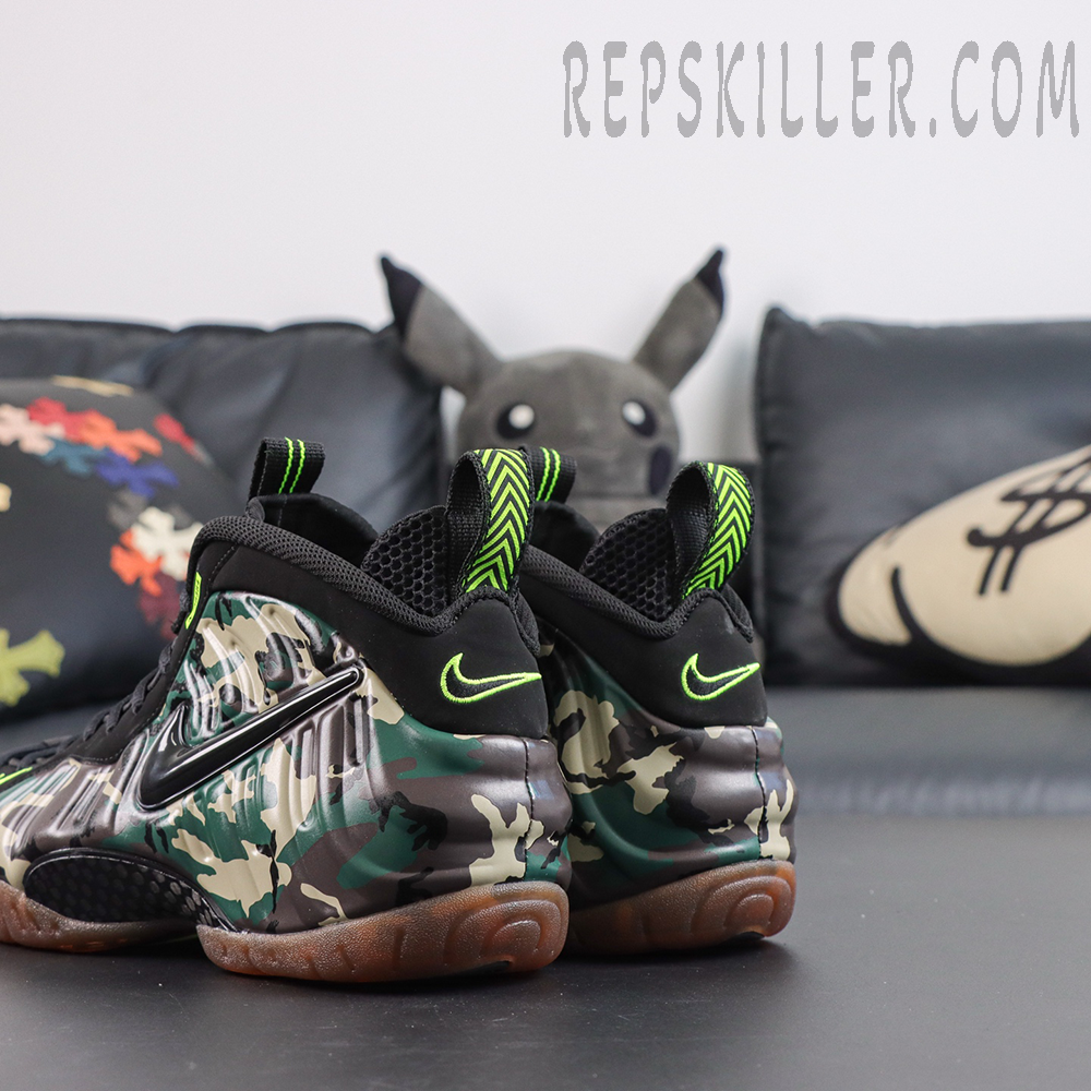 Nike Air Foamposite Pro ‘Green Camo’ rear angled view featuring raised black Swoosh, camouflage Foamposite shell and gum outsole
