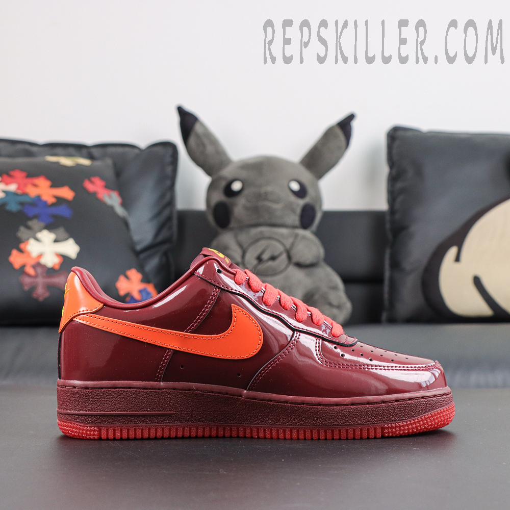 Nike Air Force 1 Low ‘Patent Leather Dark Team Red’ side view featuring the classic AF1 low-top silhouette with a glossy patent leather finish