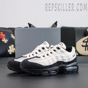 Nike Air Max 95 ‘Big Bubble - Family Reunion France’ front side view featuring white layered panels and contrasting black suede toe detailing