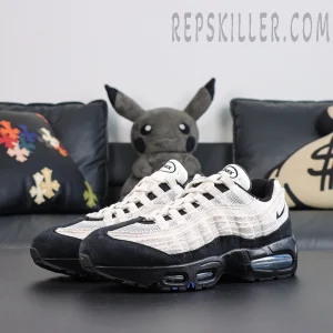 Nike Air Max 95 ‘Big Bubble - Family Reunion France’ pair side view featuring layered Air Max 95 panels with a black and white contrast design